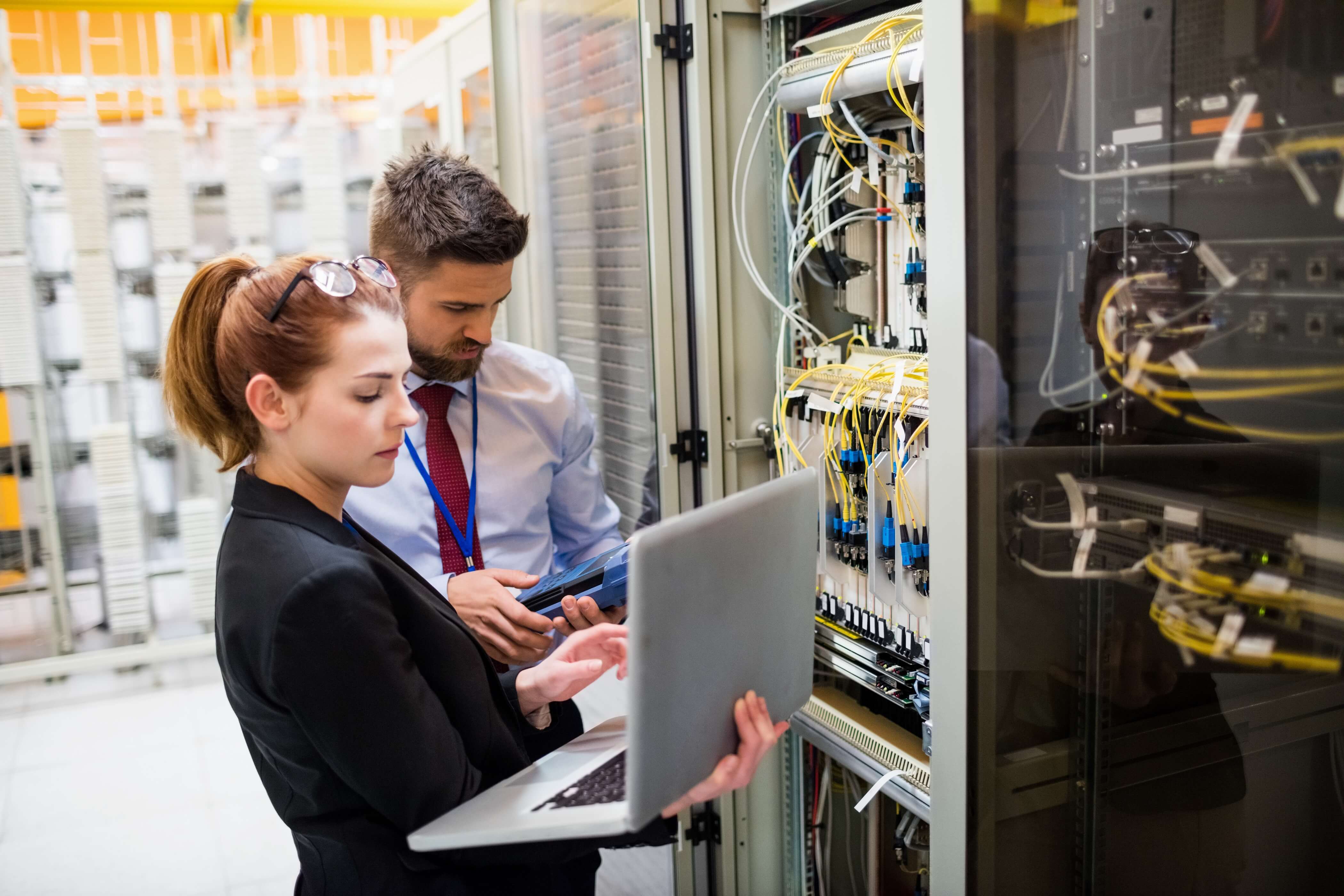 people in data center server room