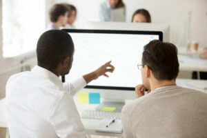 men working at a computer